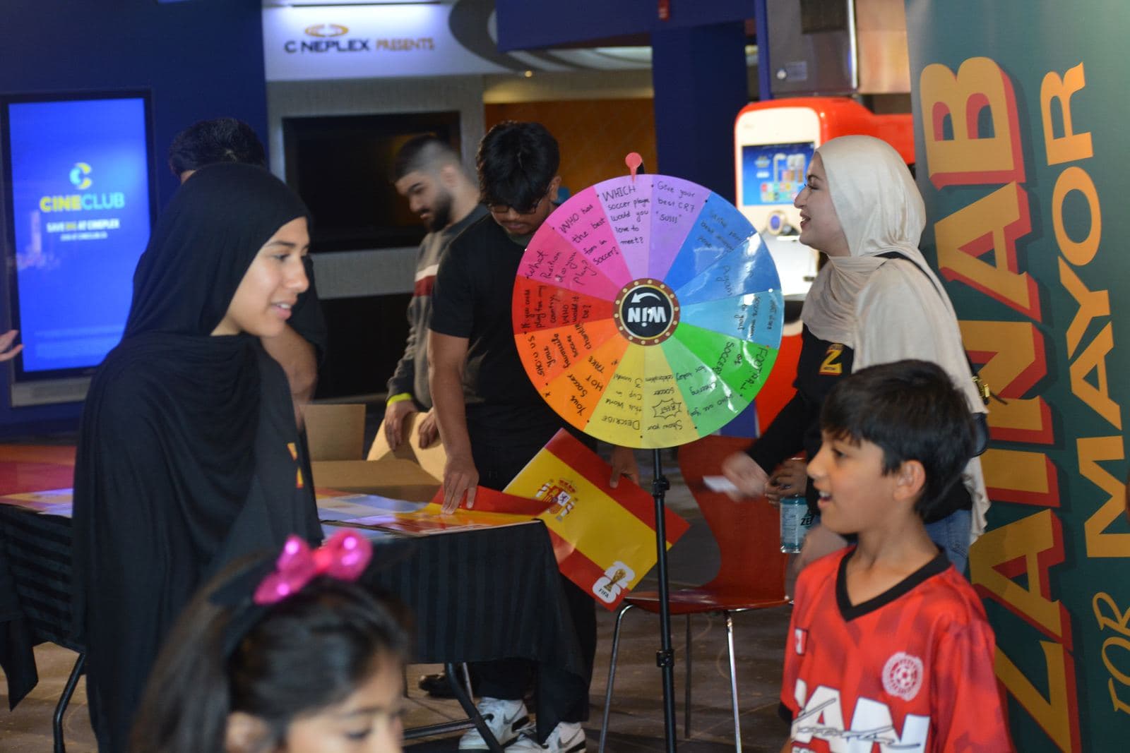 Families spinning the campaign prize wheel between screenings